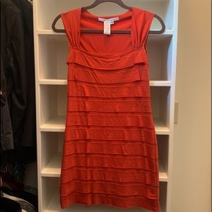 Max Studio Burnt Orange Ruffle dress with a boat neck.